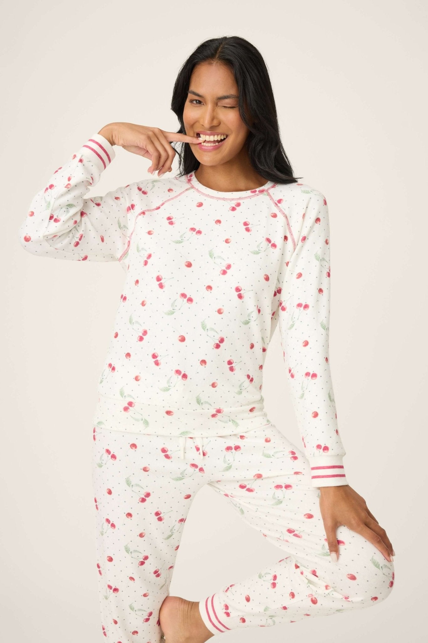 Model wearing Polka Dot Cherries Peachy Jersey Pajama Set PJ Salvage with playful cherry print and polka dots.