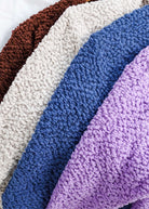 all-groups Colour Options for the popcorn summer cardigan. The colour options are brown, beige, blue and purple. 