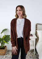 Woman wearing a brown cardigan with texture  in a bedroom setting, Popcorn Texture Open Summer Cardigan in a chocolate brown