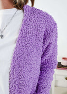 Popcorn Texture Open Summer Cardigan Woman wearing a light purple  cardigan with texture  in a bedroom setting, showing texture of the fluffy knit