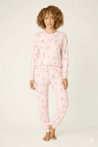 Model wearing Pupcation Palms Sunnies & Sunshine Dog Print Jogger Set by PJ Salvage in pink with playful dog prints.
