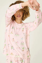 Pupcation Palms Sunnies & Sunshine Dog Print Jogger Set worn by model, showcasing playful dog prints on light pink fabric.
