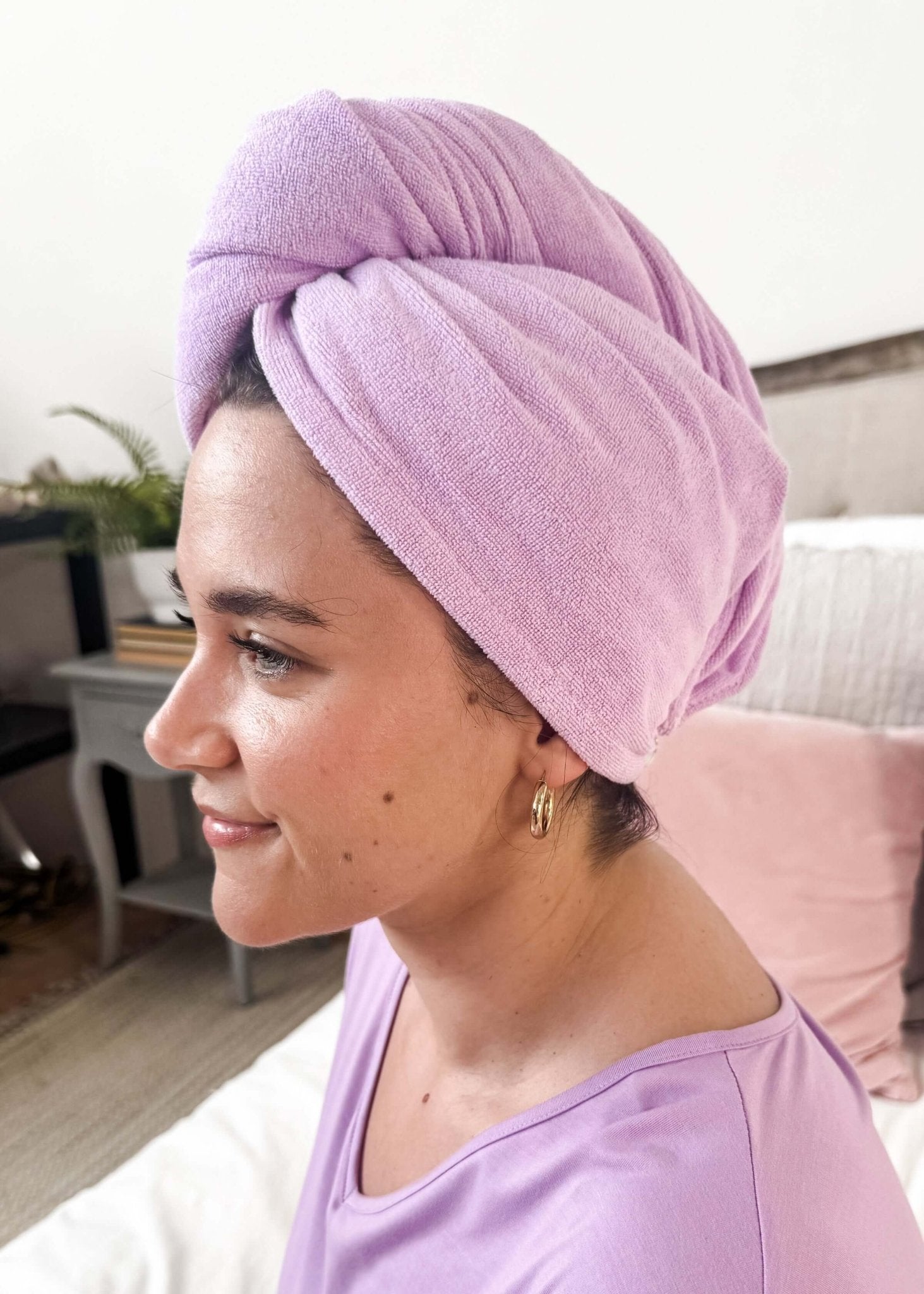Woman wearing the Remove It Quick Dry Microfiber Hair Towel Wrap in lavender, showcasing efficient hair drying.