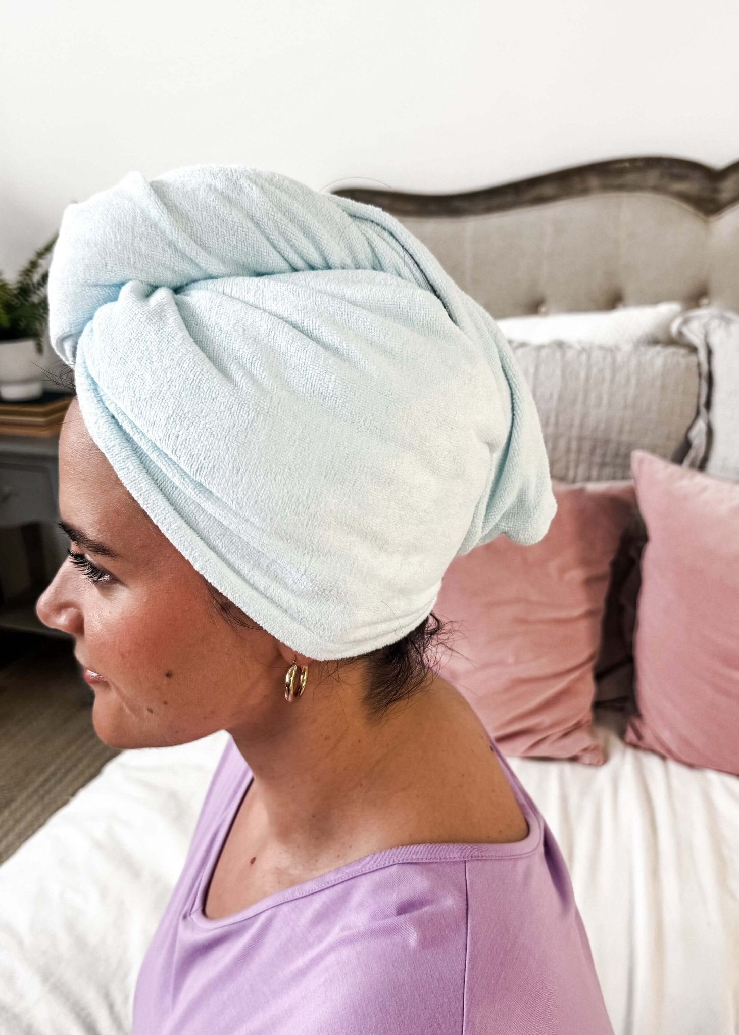 Remove It Quick Dry Microfiber Hair Towel Wrap on a woman, showcasing its quick-drying and anti-frizz features.