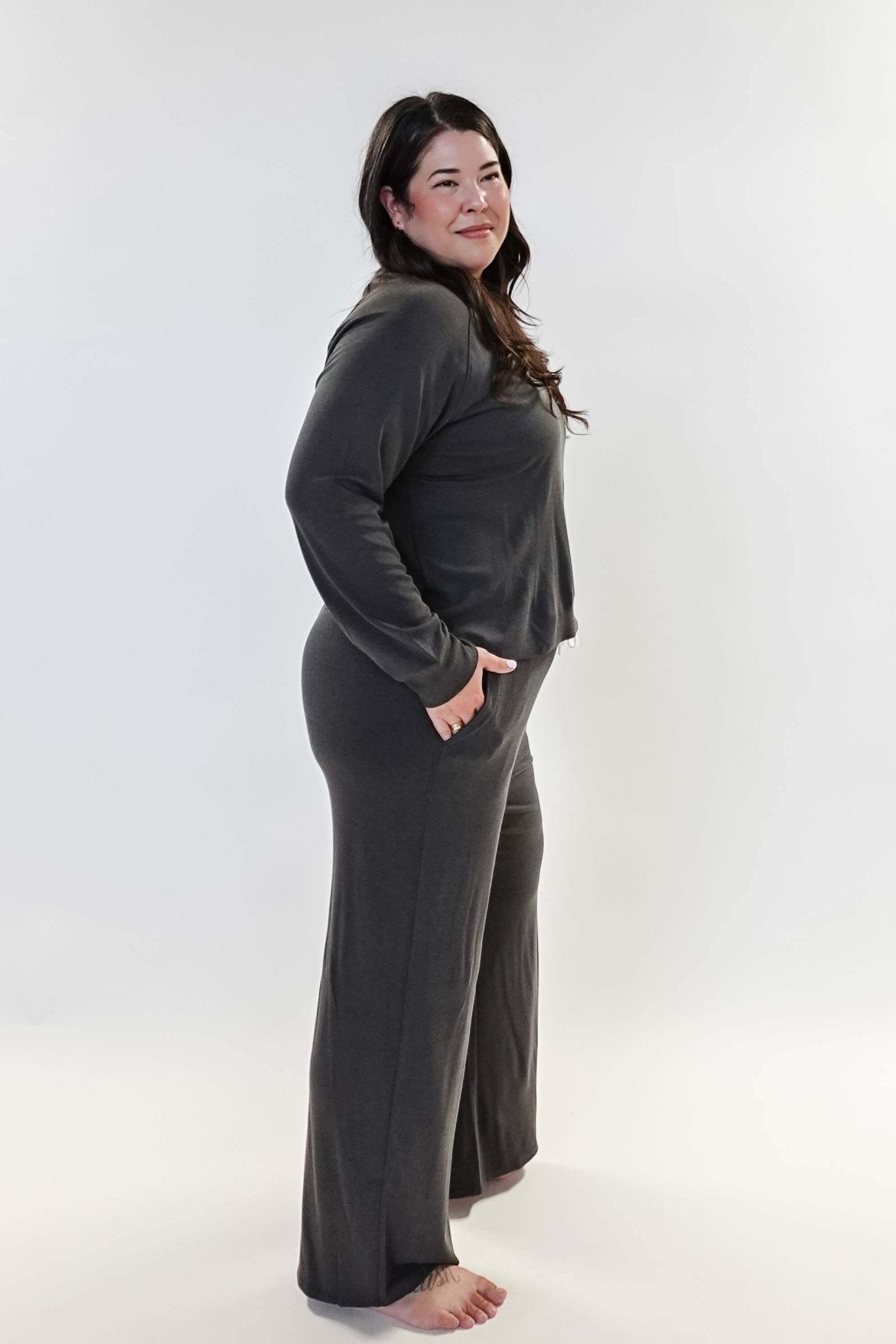 Long Sleeve Raw Edge Straight Pant Lounge Set modeled by a woman in a gray outfit, showcasing comfort and style.