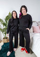 Black Long Sleeve Raw Edge Straight Pant Cloud Lounge Set worn by two women in a stylish home setting.