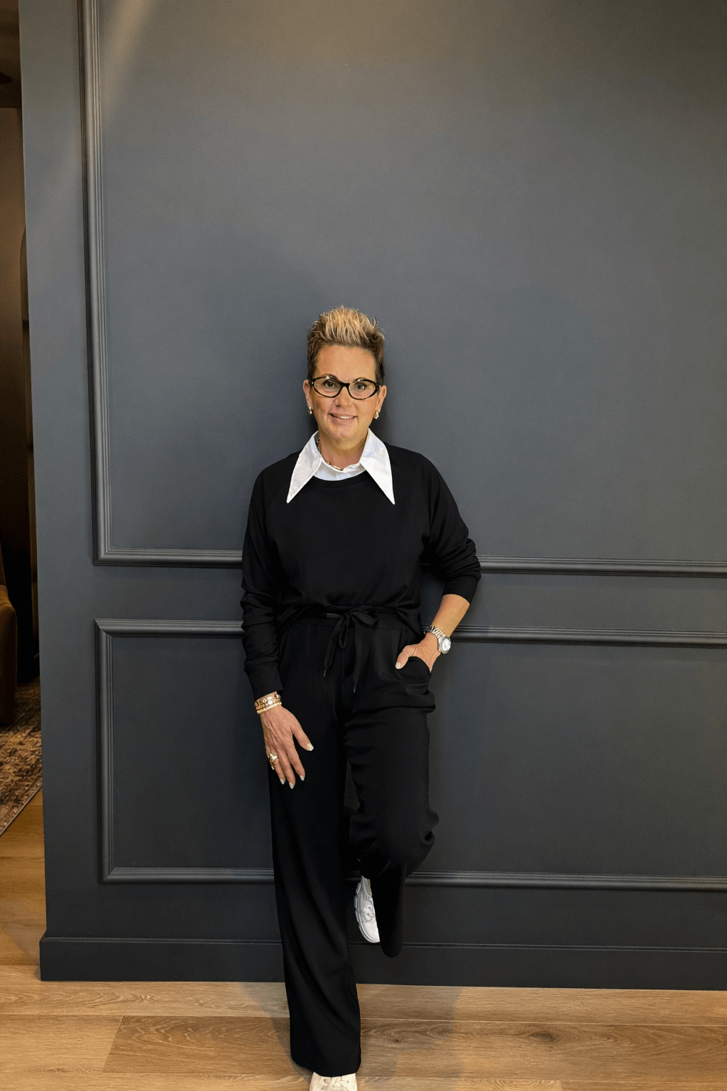 Black Long Sleeve Raw Edge Straight Pant Cloud Lounge Set worn by a stylish woman against a dark wall.