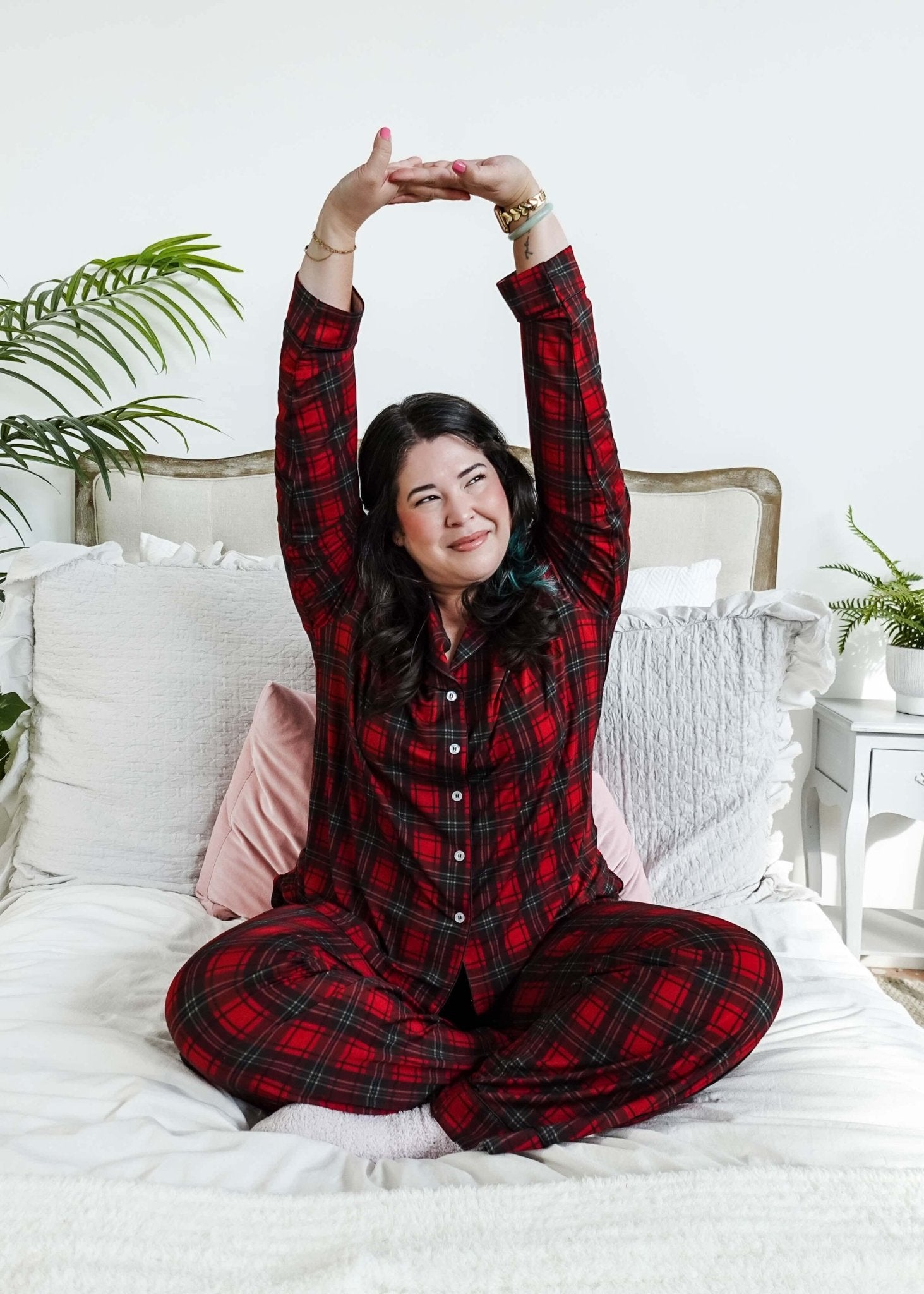 woman stretching on bed wearing Red Plaid Button Up Bamboo PJ Set Straight Leg Pant 