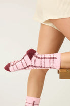 Pair of PJ Salvage Pink & Burgundy Plaid Fuzzy Crew Socks showing the cheerful pattern and plush texture.