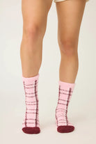 Pair of PJ Salvage Pink & Burgundy Plaid Fuzzy Crew Socks showing the cheerful pattern and plush texture.