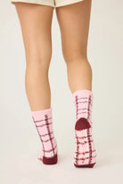 Pair of PJ Salvage Pink & Burgundy Plaid Fuzzy Crew Socks showing the cheerful pattern and plush texture.