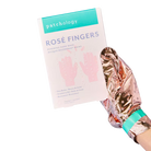 Rose gold hand mask with packaging labeled 'Patchology Rosé Fingers' on a white background, Patchology Rosé Fingers renewing hand mask rose gold gloves shea butter