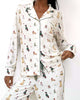 Flora Pillowsoft Sleep Set Splendid featuring silky soft button-down pajamas with playful festive dog prints.