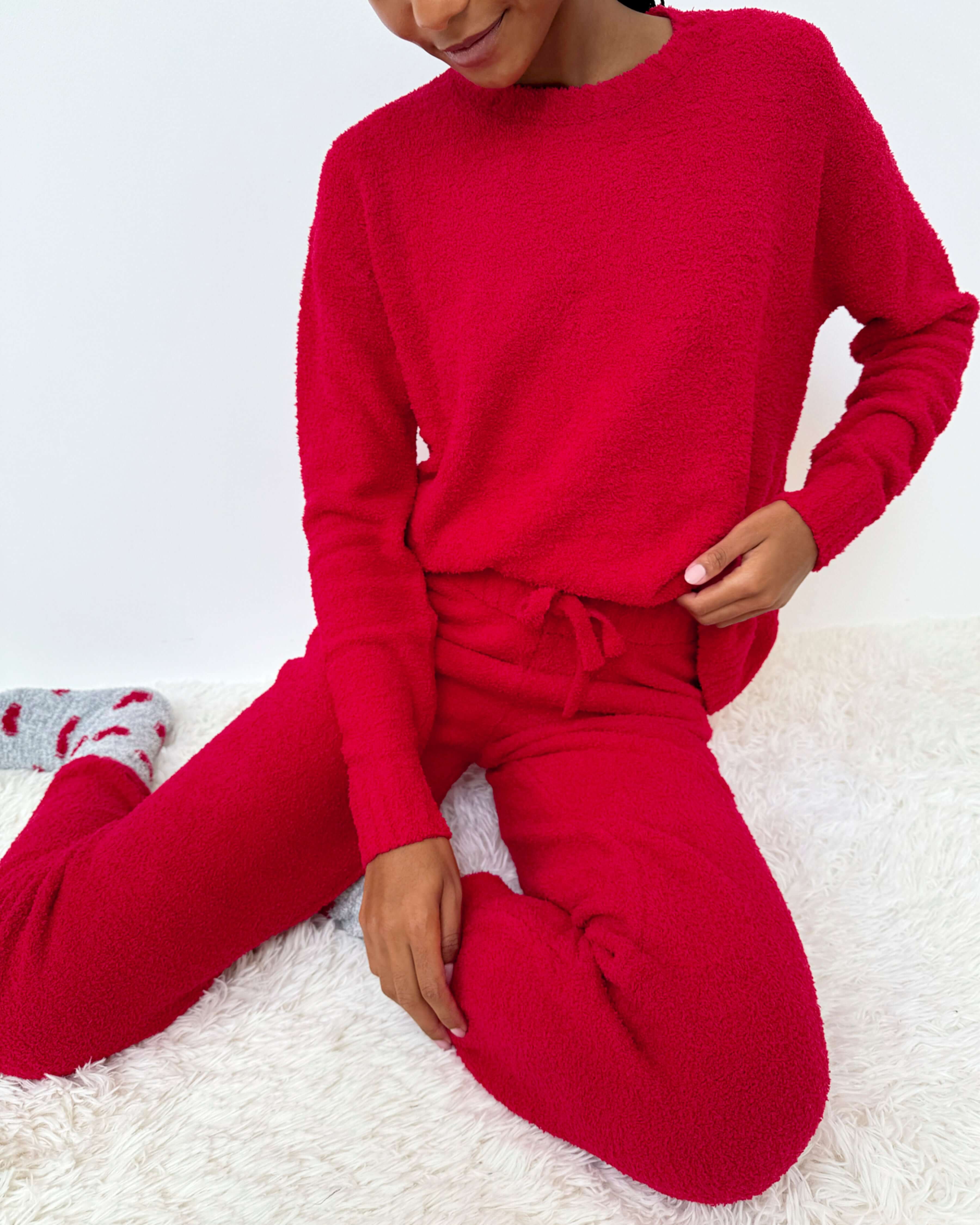 Woman wearing Cloud-Soft Fuzzy Sweater Pajama Set Splendid in vibrant red, showcasing ultimate comfort and style.