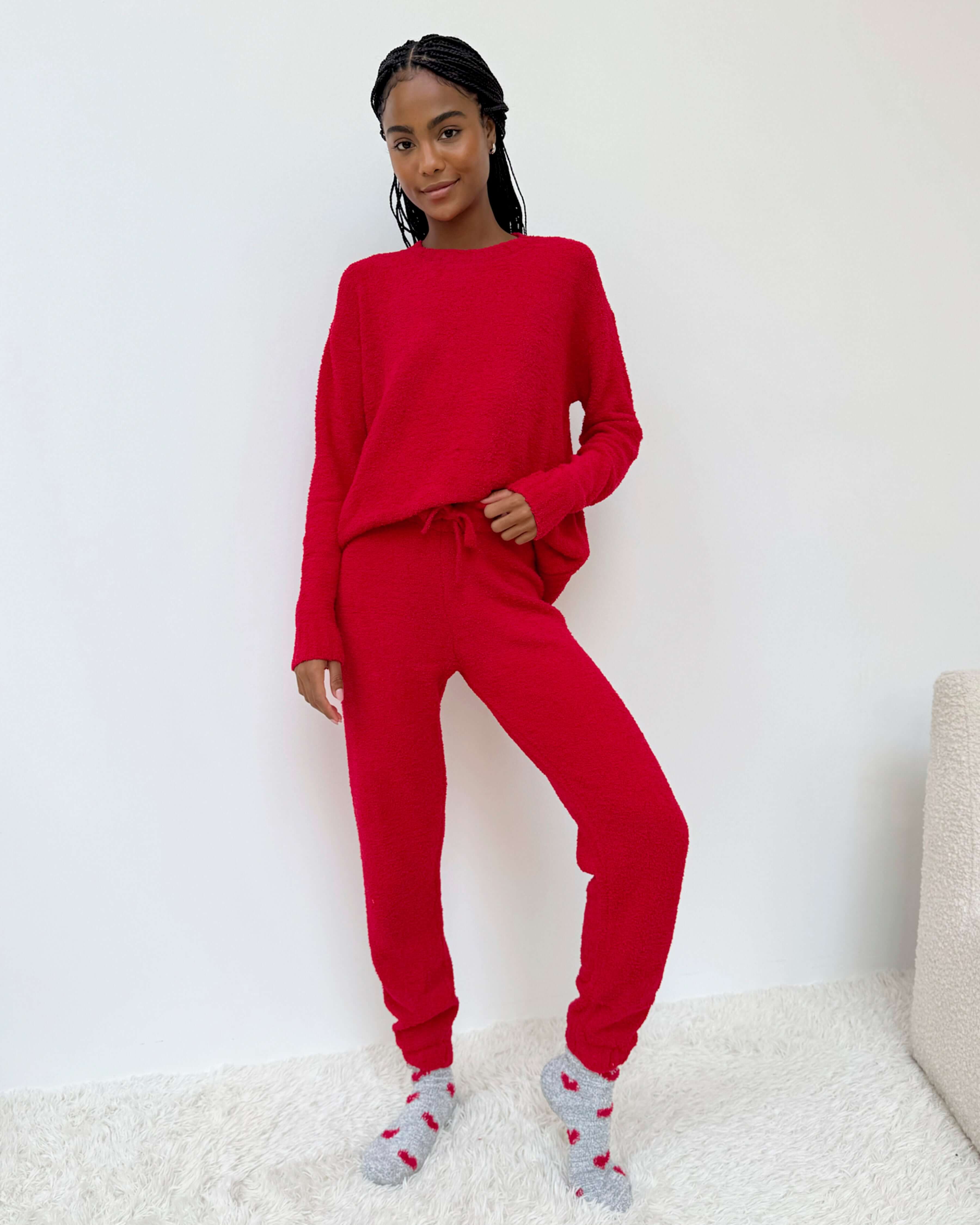 Woman wearing Cloud-Soft Fuzzy Sweater Pajama Set Splendid in vibrant red, showcasing ultimate comfort and style.