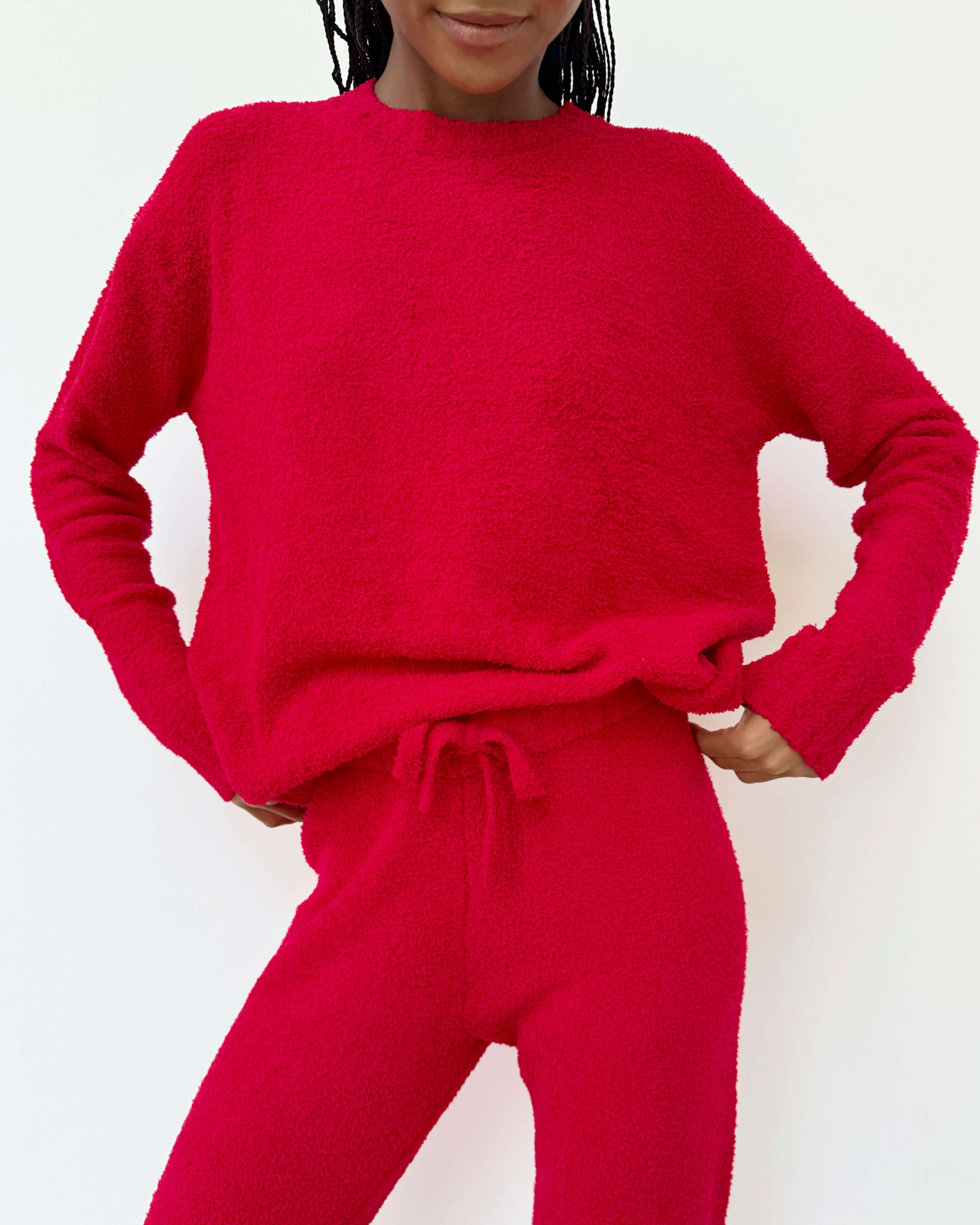 Woman wearing Cloud-Soft Fuzzy Sweater Pajama Set Splendid in vibrant red, showcasing ultimate comfort and style.