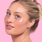 Woman with cosmetic patches under eyes on a pink background, Patchology Serve Chilled Rosé Eye Gels 5 pack antioxidant hydrating