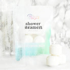 Shower Steamer 6pk Eucalyptus Mint package with steam and shower setting, perfect for aromatherapy.