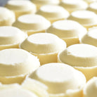 Shower Steamer 2pk Grapefruit Orange aromatherapy steamers stacked together for a soothing spa-like experience.