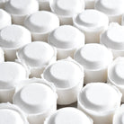 Close-up of white shower steamers, part of the Shower Steamer 2pk Lemon Lavender, ready for a spa-like experience.