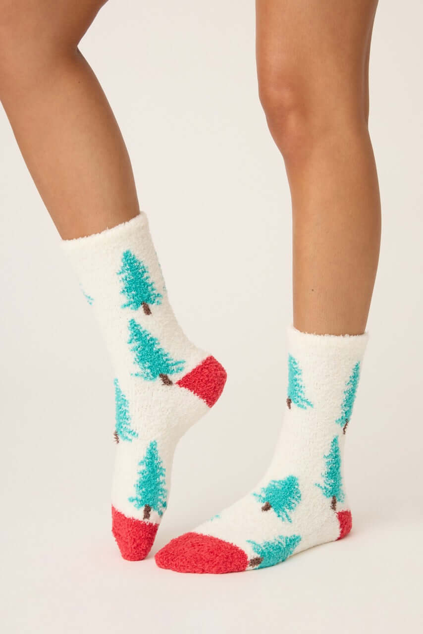Pair of PJ Salvage "Sleigh All Day" Fuzzy Cozy Socks in ivory with green tree print and red heel