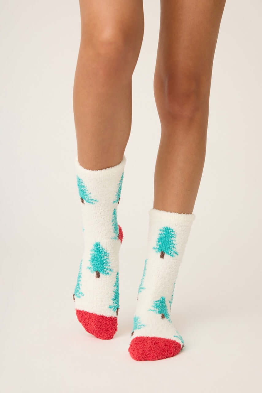 Sleigh All Day Socks with tree print and red grippers, perfect for cozy winter wear. PJ Salvage's fuzzy socks.