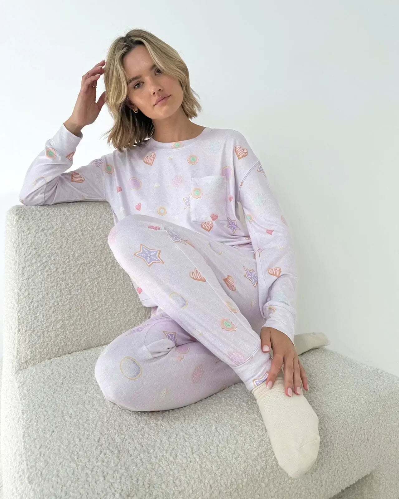 Model wearing the Splendid Holiday Sugar Cookie Marna Pillowsoft PJ Set, featuring festive prints on soft fabric.
