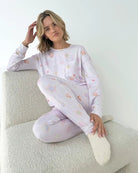 Model wearing the Splendid Holiday Sugar Cookie Marna Pillowsoft PJ Set, featuring festive prints on soft fabric.