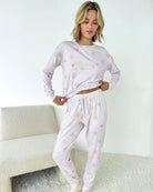 Woman wearing Splendid Holiday Sugar Cookie Marna Pillowsoft PJ Set, featuring festive prints for cozy holiday lounging.