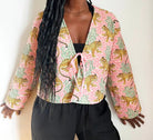 Quited Handmade Clara Jacket in Pink Leopard by French Toast Handmade. Worn by model standing against a light background. 