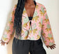 Quited Handmade Clara Jacket in Pink Leopard by French Toast Handmade. Worn by model standing against a light background. 