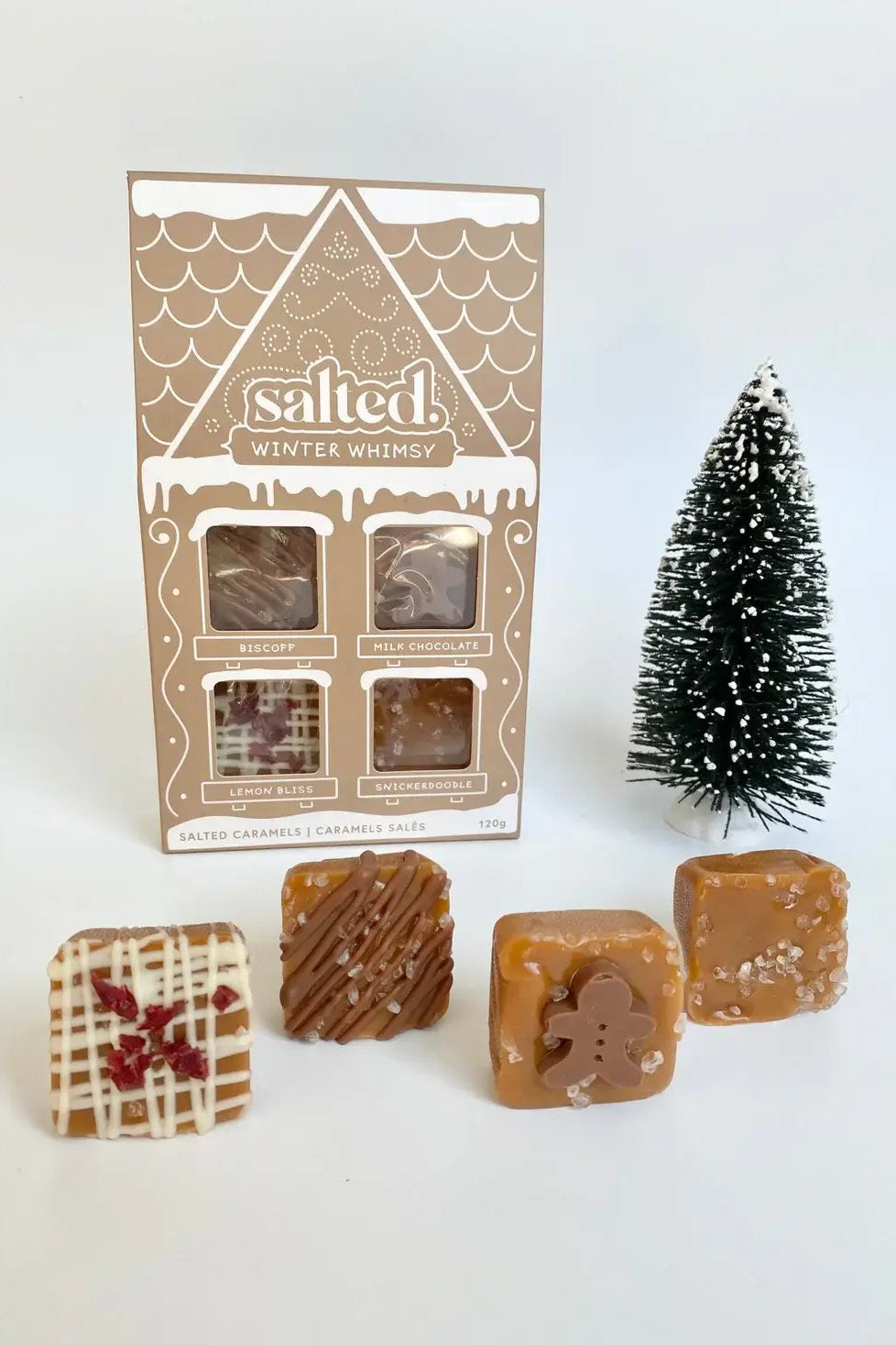 all-groups Salted Winter Whimsy 4 pieces of Packaged salted caramel candies with a small Christmas tree on a white background
