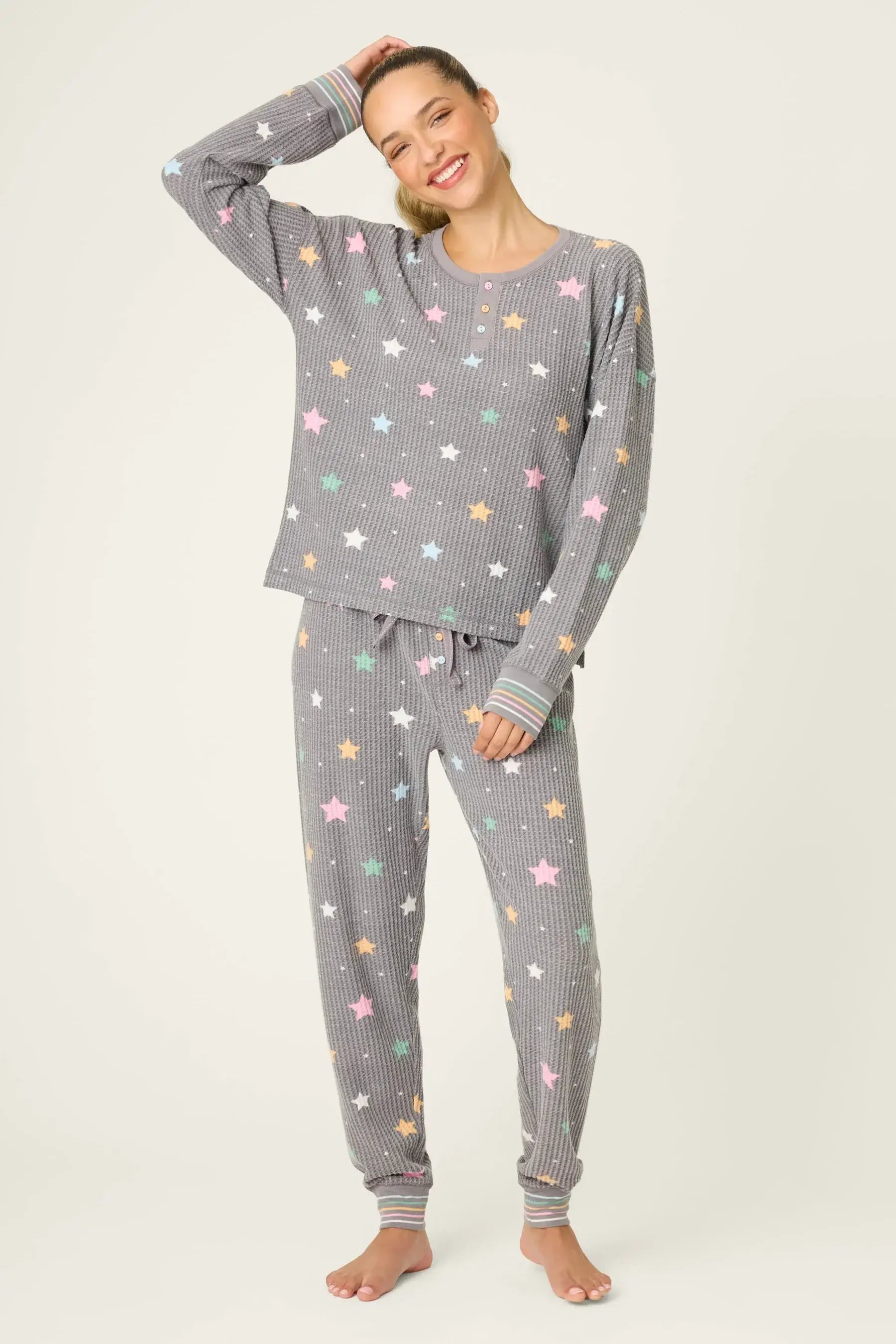 women's thermal waffle pj set with star print and charcoal grey background. Long sleeve top with buttons and Jogger bottoms by PJ Salvage