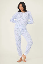 Mountain Dreams Thermal PJ Set worn by model, featuring long sleeve top and jogger bottoms with a cozy winter print.