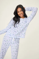 Model wearing the Mountain Dreams Thermal PJ Set with long sleeves and joggers in a cozy, winter-themed design.