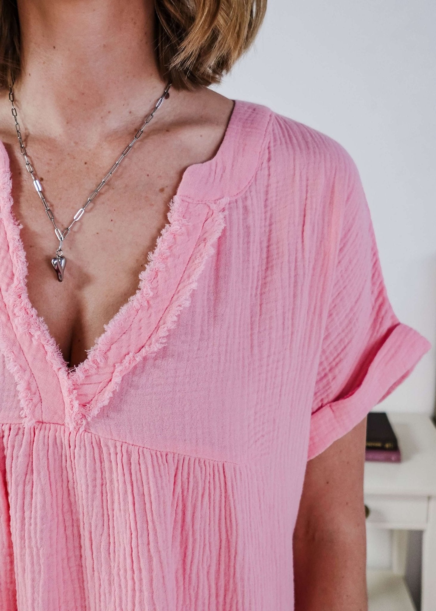 women in light weight gauze cotton pink dress Scarlett Ellie V-Neck Gauze Dress | Lightweight Summer Dress | Cloud Nine Pajamas close up showing texture of the cotton gauze