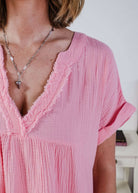 women in light weight gauze cotton pink dress Scarlett Ellie V-Neck Gauze Dress | Lightweight Summer Dress | Cloud Nine Pajamas close up showing texture of the cotton gauze