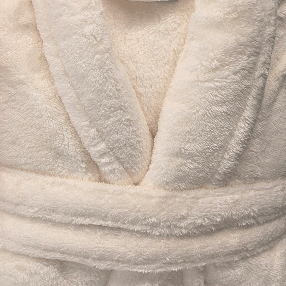 warm buddy plush robes folded showing texture cream robe