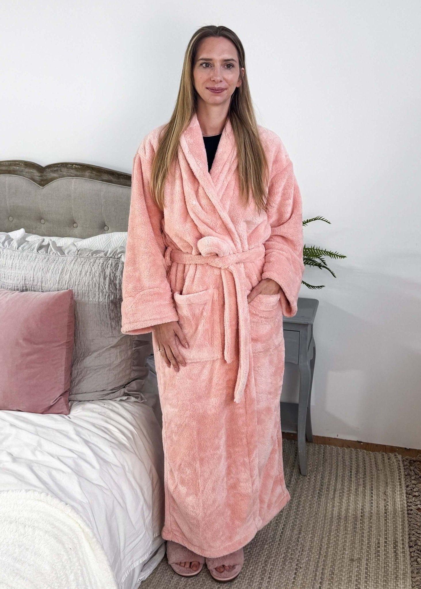 WARM BUDDY - Cozy Ultra Plush Spa Robe in Pink, Shown on a women on a bedroom setting showing full length on model who is 5'8"