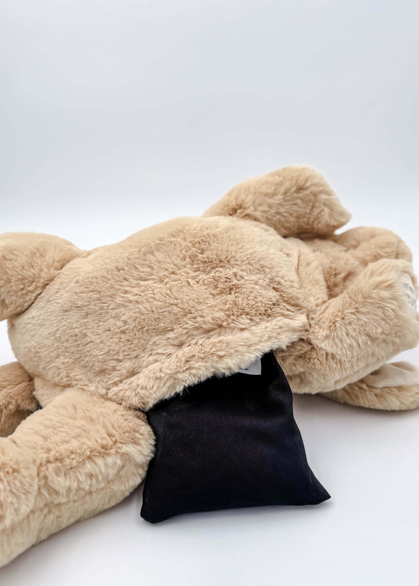 Warm Buddy Cuddle Buddy Tan Lab Puppy 18" Heat Up Stuffed Animal therapeutic heat up beige dog weighted showing the opening for the microwaveable heat pack 