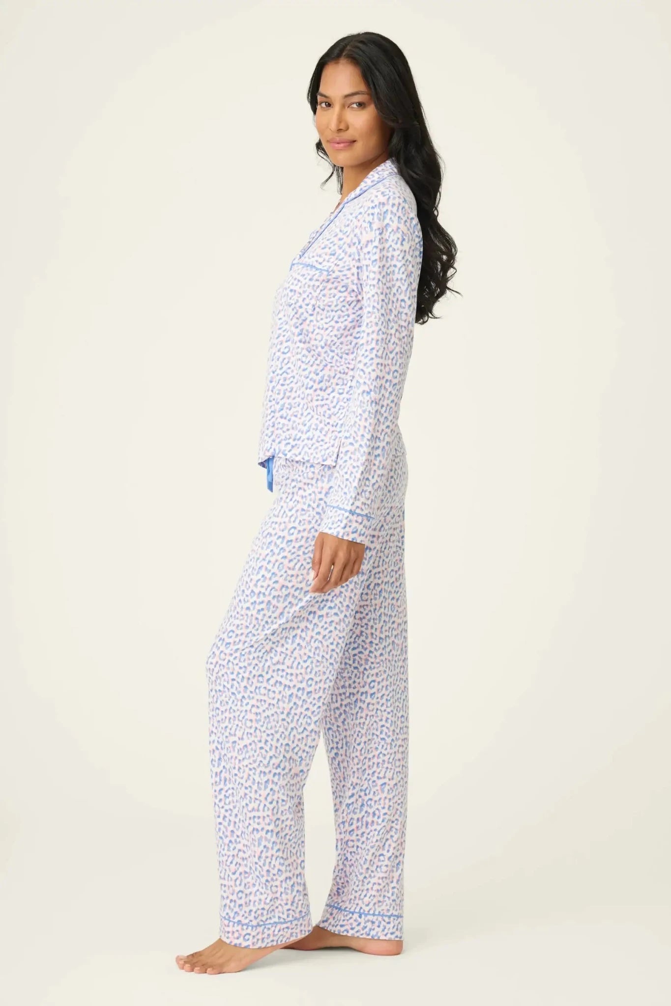 Model wearing the Whimsy Walk On The Wild Side PJ Set by PJ Salvage in playful leopard print design.