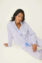 Model wearing Whimsy Walk On The Wild Side PJ Set by PJ Salvage, featuring colorful leopard print and comfortable design.