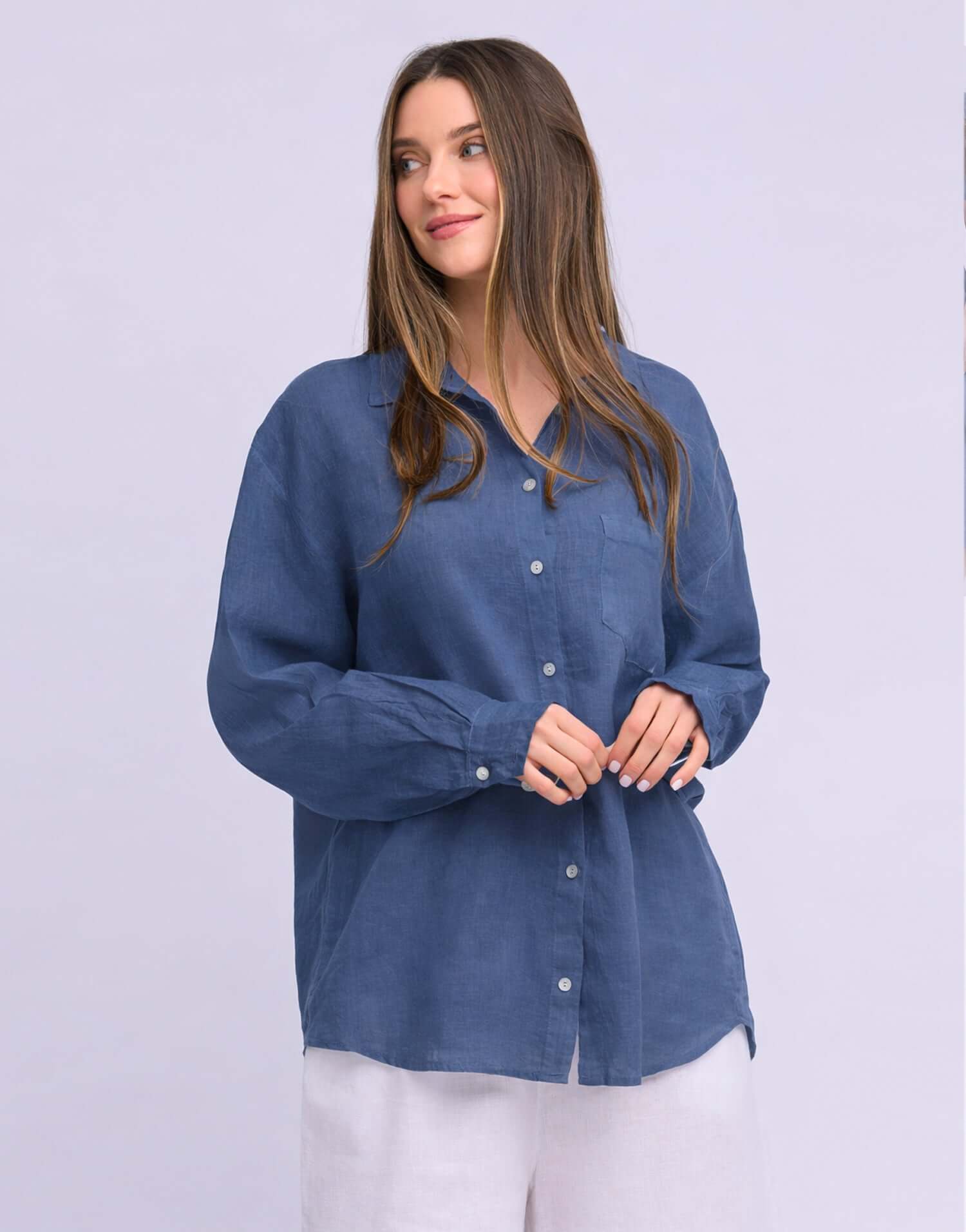Yoga Jeans Elena Linen Oversized Button Up Top in a soft blue color, featuring a relaxed fit and button-down front.