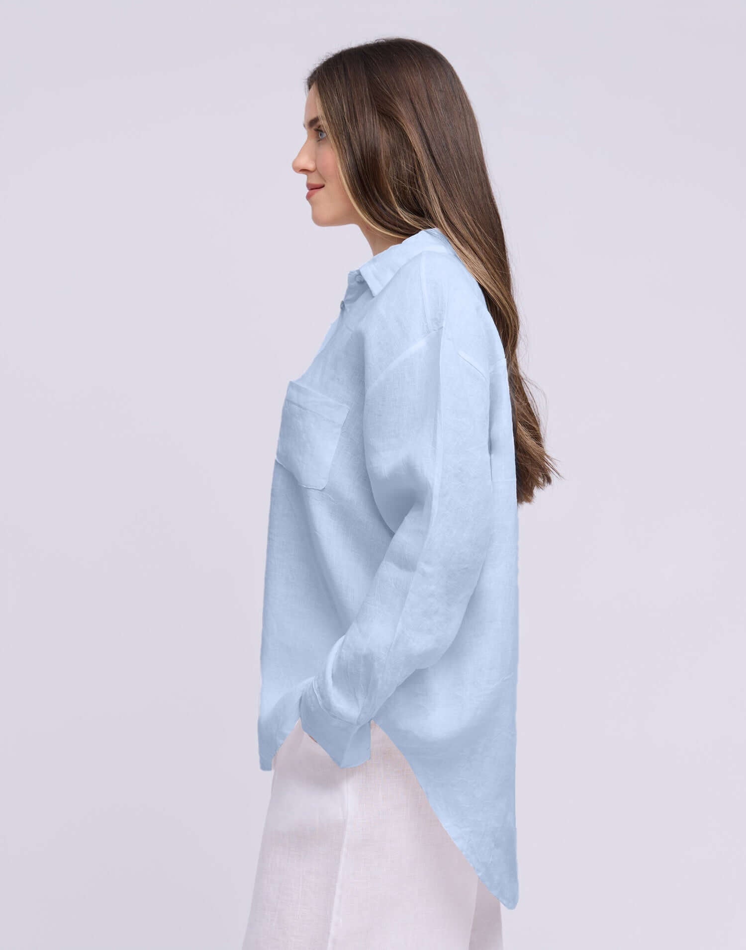 Yoga Jeans Elena Linen Oversized Button Up Top in light blue, featuring a relaxed fit and single chest pocket.
