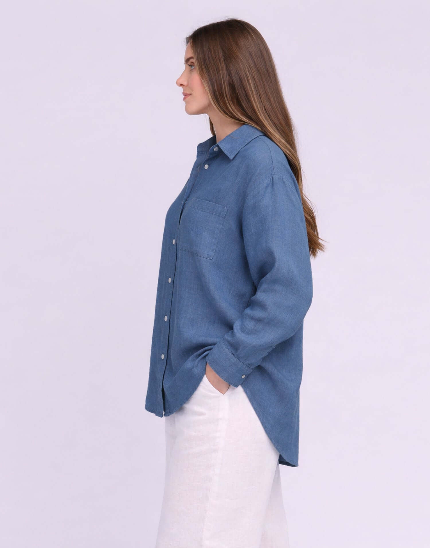 Yoga Jeans Elena Linen Oversized Button Up Top in soft blue, showcasing a side view with relaxed fit and stylish buttons.