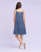 YOGA JEANS Isabella Linen Spaghetti Strap Dress showcased from the back, featuring a tiered design and adjustable straps.