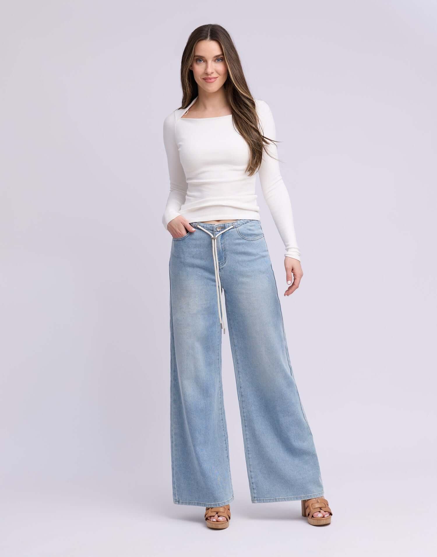 Yoga Jeans LILY Wide Leg Drawstring Jeans in Rihanna Wash, styled with a fitted long-sleeve top.