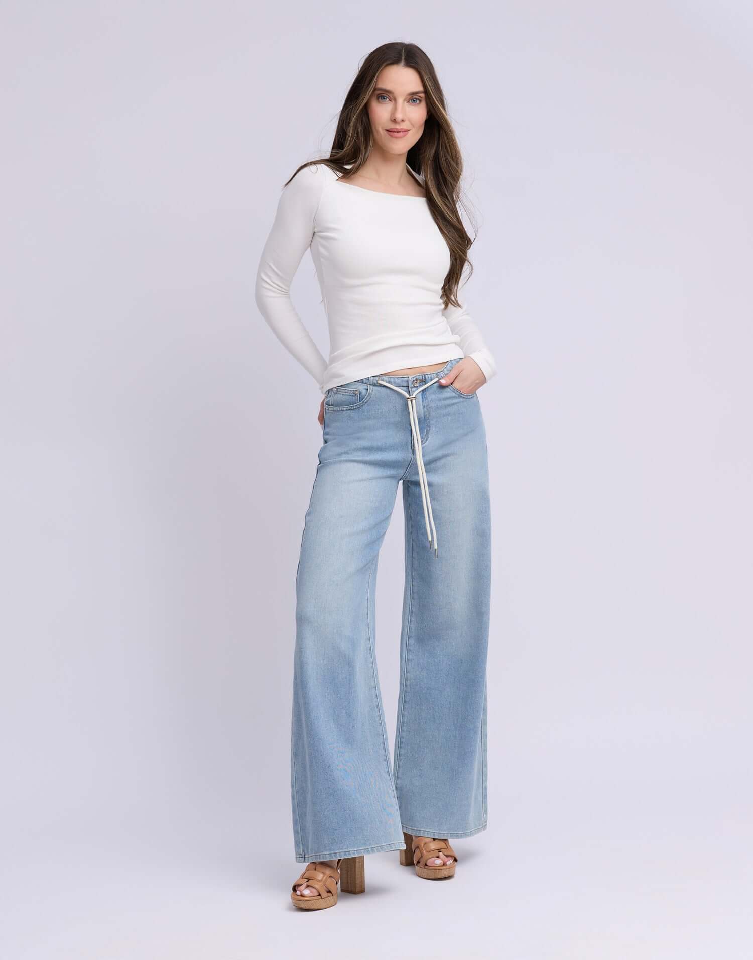 Yoga Jeans LILY Wide Leg Drawstring Jeans - Rihanna Wash model wearing a white top and wide leg jeans.