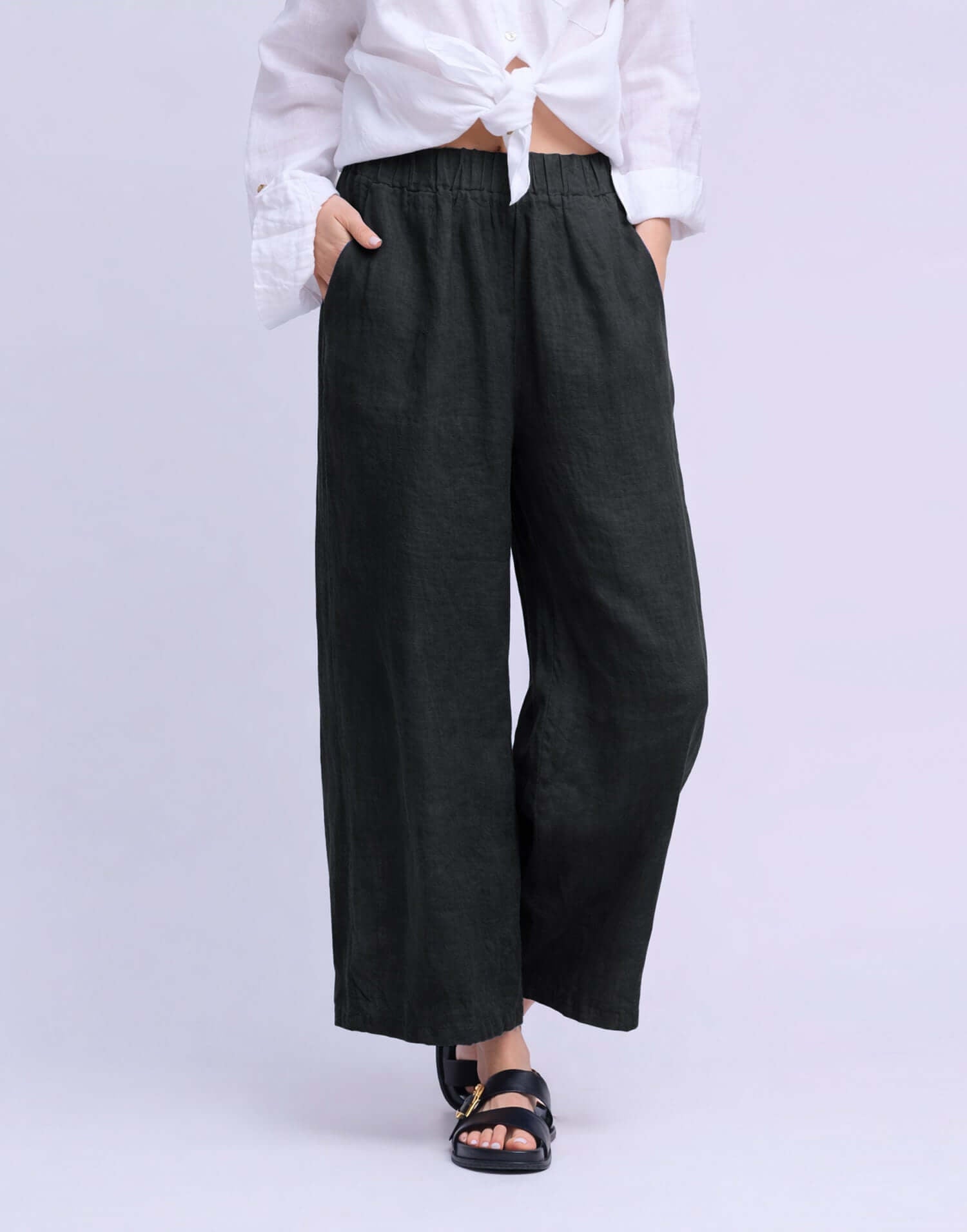 YOGA JEANS Sofia Linen Wide Leg Pant showcased on model wearing a white shirt and sandals.