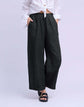 YOGA JEANS Sofia Linen Wide Leg Pant showcased on model wearing a white shirt and sandals.